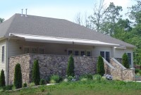 Residential roof mounted retractable porch awning 12a.